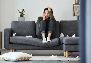 person crying sofa