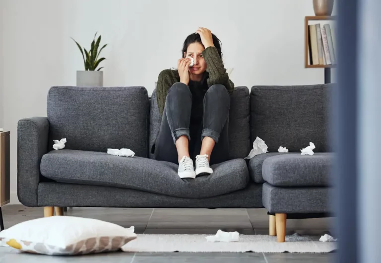 person crying sofa