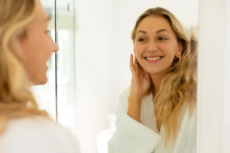 woman smiling mirror